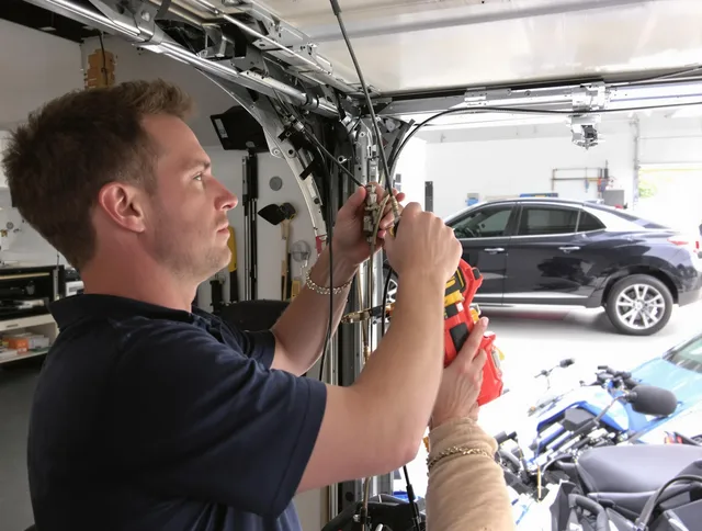 Pine Hills Garage Door Repair safety certified technician performing cable replacement in Pine Hills