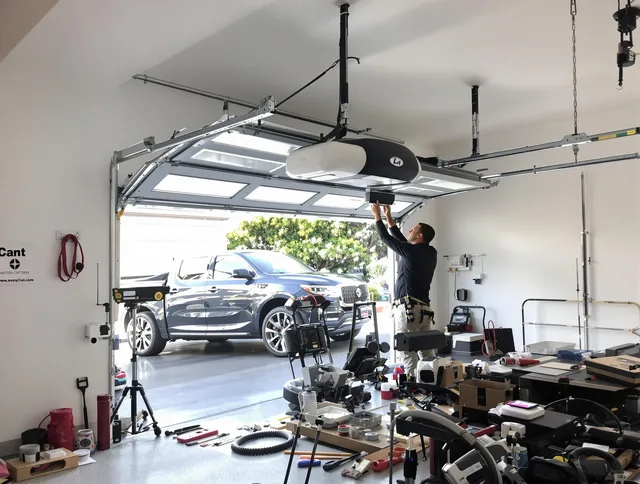 Pine Hills Garage Door Repair specialist installing smart garage door opener system in Pine Hills home